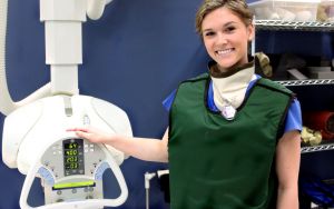 female with mammography scanner